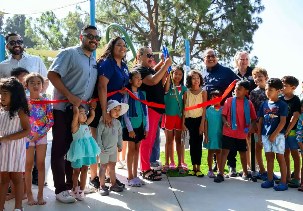 Santa Ana Mayor Valerie Amezcua, center, cuts the ribbon for...