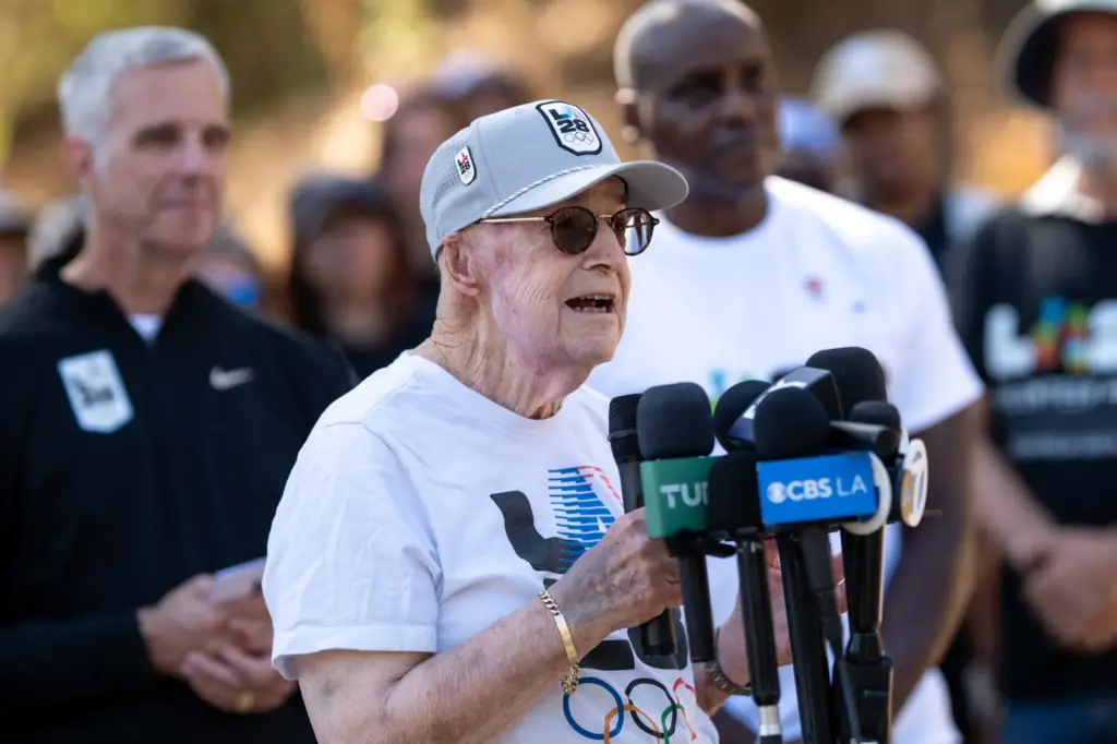 1994 Olympic volunteer Paul Madwin asks for people to sign...