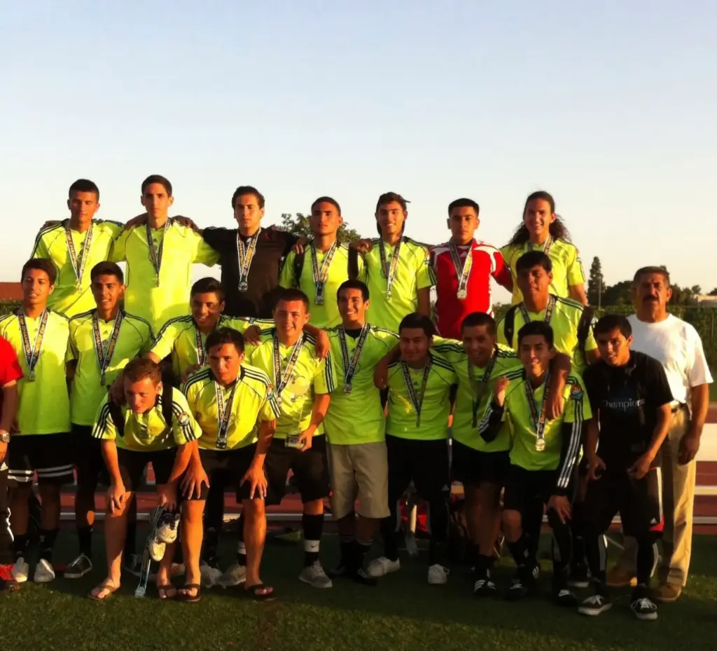 Cristian Roldan, back row, fourth from left, poses with teammates...