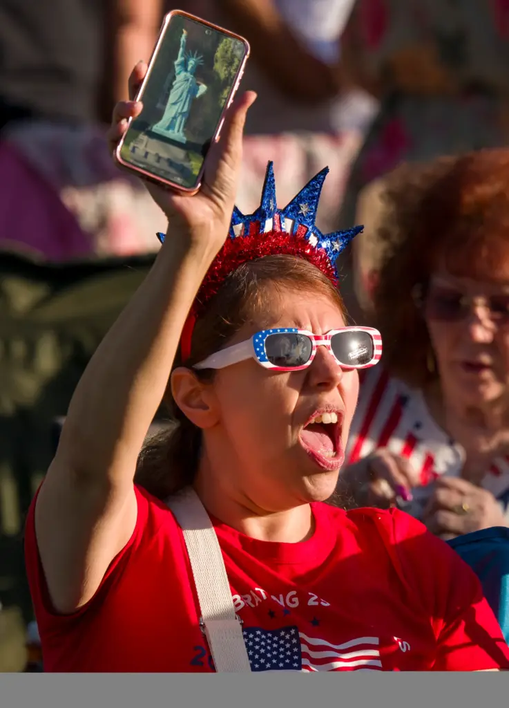 Anne Urich of Orange sings along to the song, âBorn...