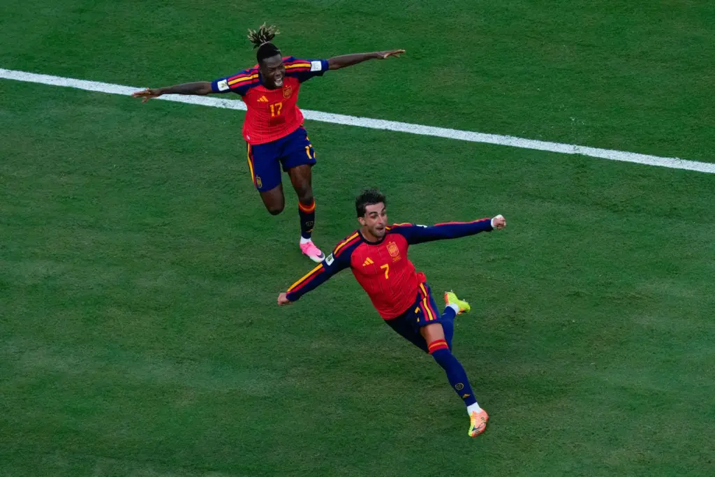 Spain’s Ferran Torres (7) celebrates scoring their first goal with...