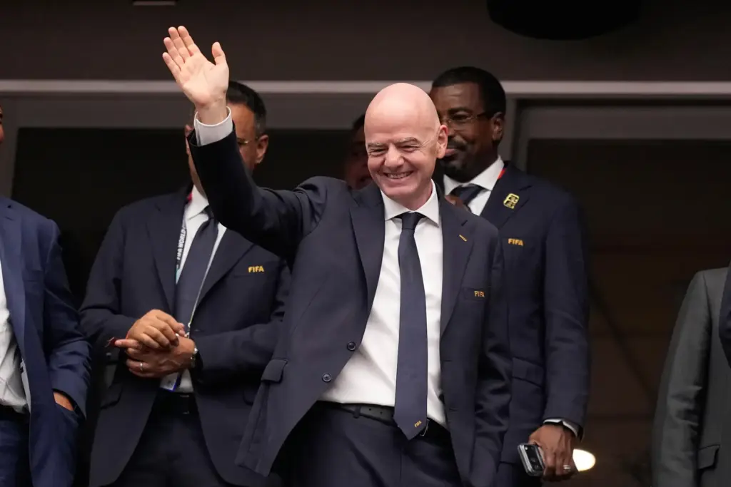 FIFA President Gianni Infantino waves ahead of the World Cup match between Canada and Morocco.
