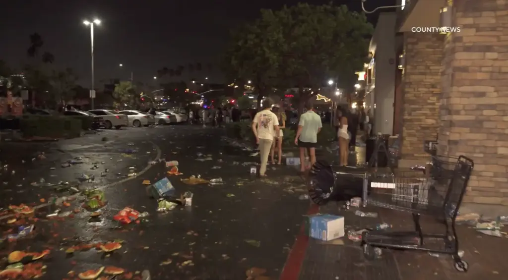 The aftermath of people looting a Pavilions supermarket at night,...