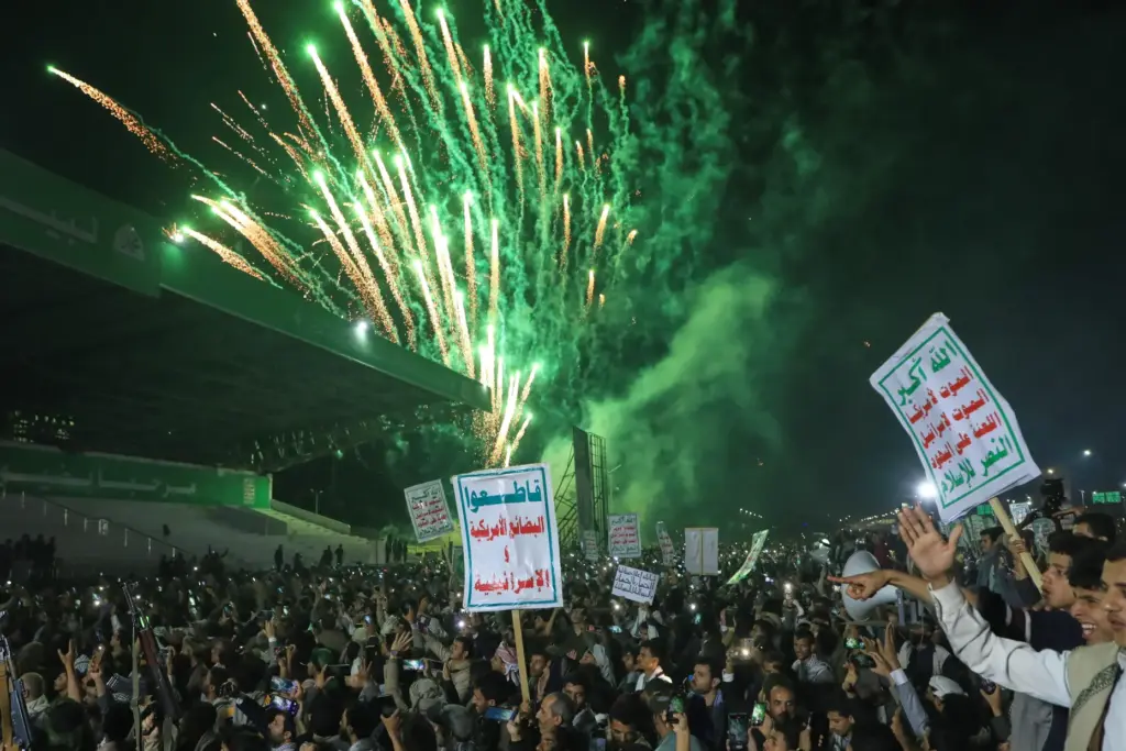 Fireworks burst as Houthi supporters rally against the Saudi-led coalition...