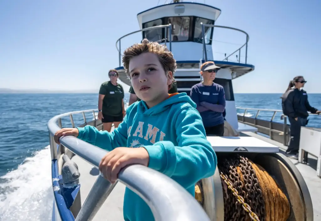 Benjamin Hochheiser, 8, holds onto a railing as he and...