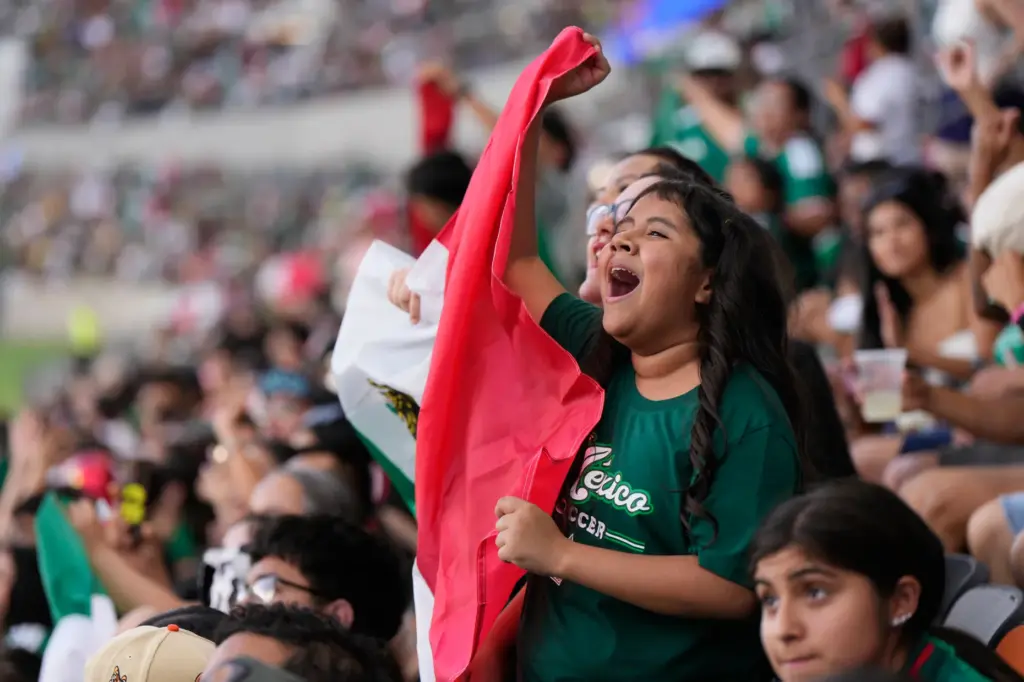 Mexico fans cheer at Shell Energy Stadium, home of the...