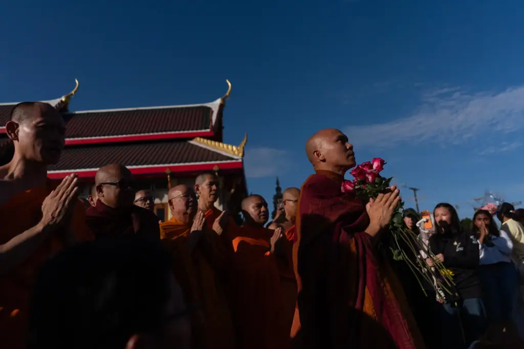 Bhikkhu Pannakara, foreground right, a Buddhist monk who led a...