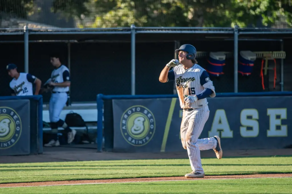 Arroyo Seco Saints infielder Owen Mangini trots home after his...