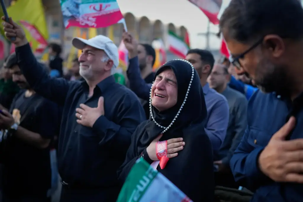 A woman weeps at the Imam Khomeini Mosalla Grand Mosque.