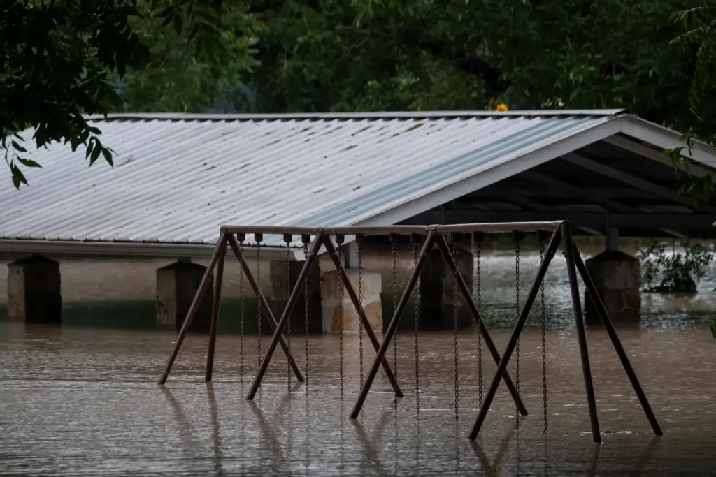 Water along the Pedernales River floods the Gillespie County Safety Rest Area.