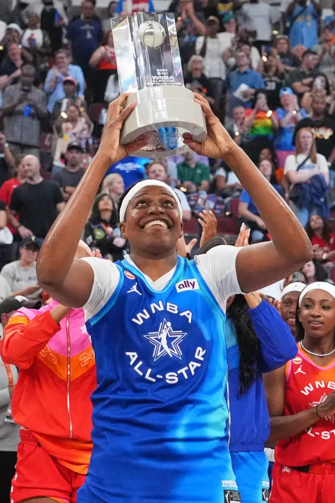 Team Spoon’s Jonquel Jones smiles as she holds up the...