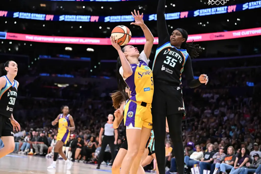 Sparks forward Dearica Hamby, left, drives to the basket as...