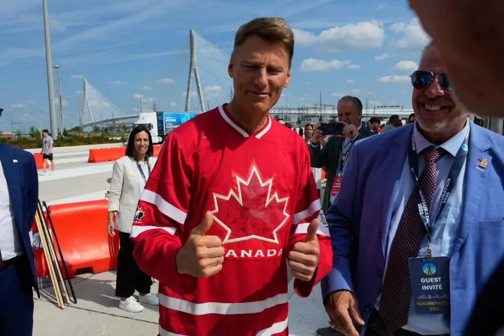 Gregor Robertson gives thumbs up during a Canadian celebration for the Gordie Howe International Bridge.