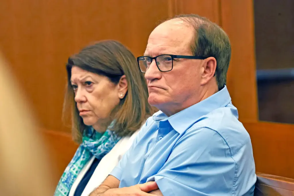 Paula and Mike Musgrove, parents of Lindsay Clancy, sit as...
