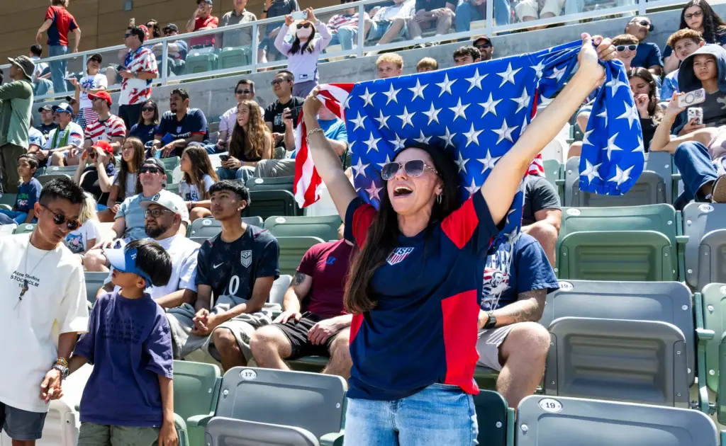 Martha Gray, right, cheers for the U.S. Menâs National Team...