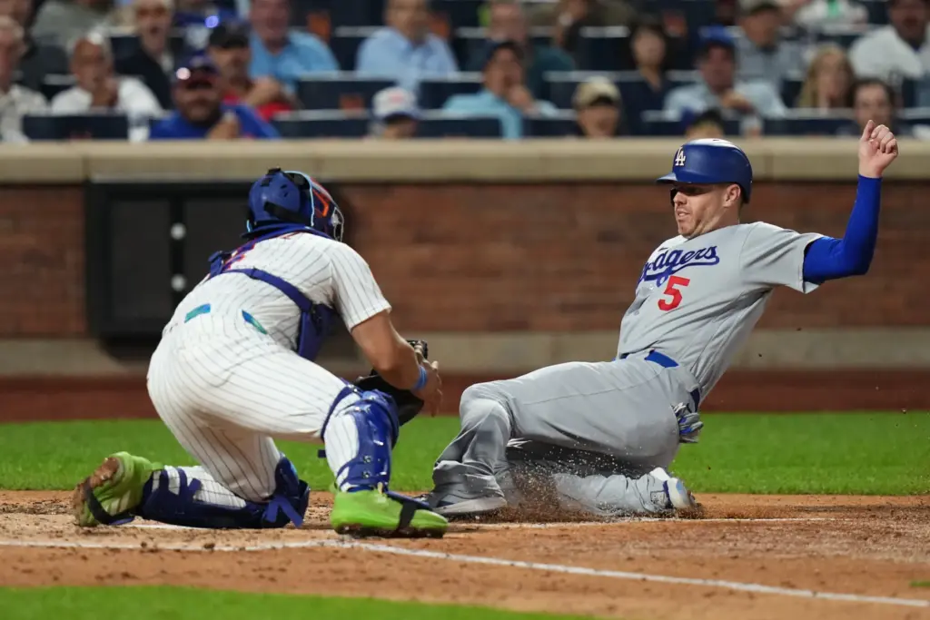 New York Mets catcher Francisco Alvarez, right, tags out Dodgers’...