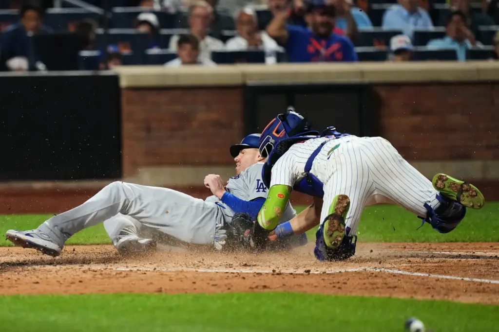 New York Mets catcher Francisco Alvarez, right, tags out Dodgers’...