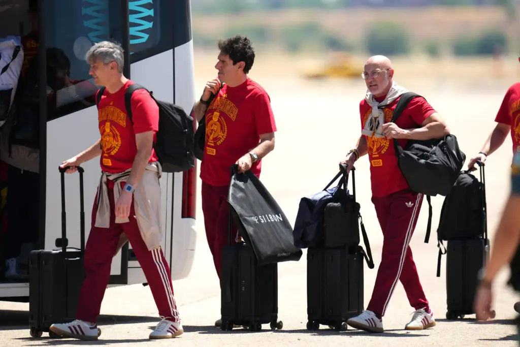 Players from Spain’s national soccer team arrive at Madrid airport...