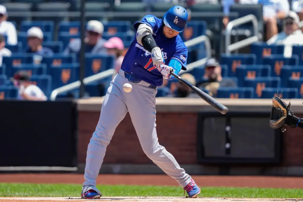 Dodgers designated hitter Shohei Ohtani hits a double during the...