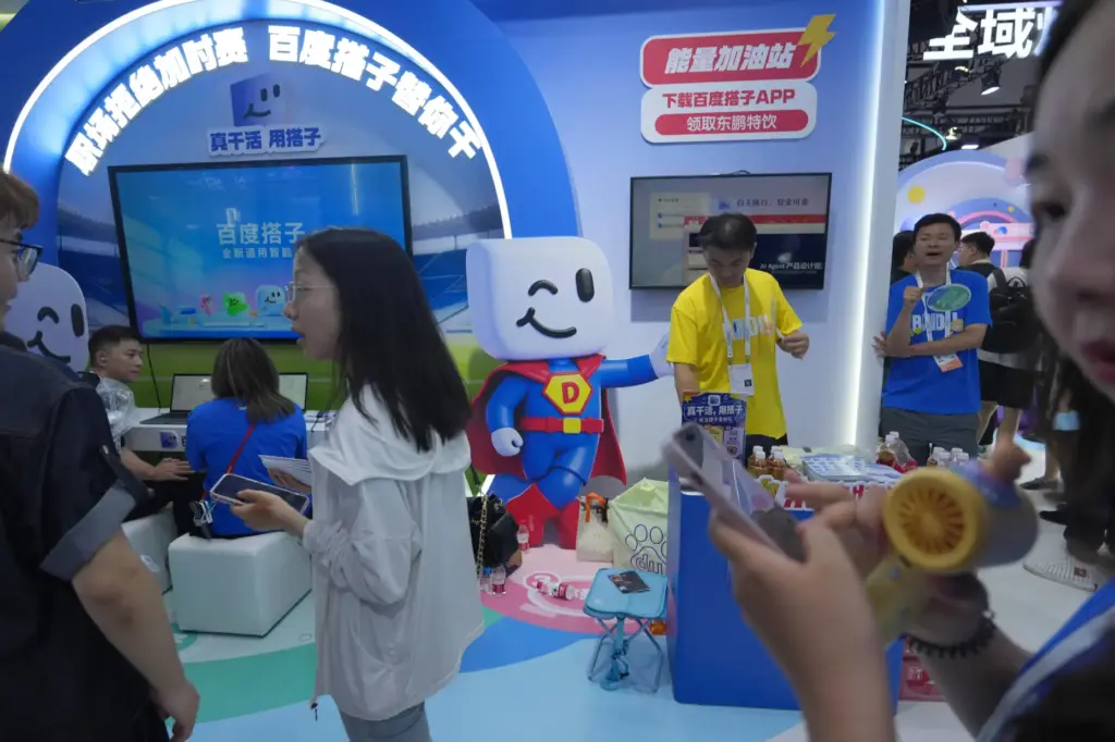 Visitors at the booth for Baidu’s AI Agent Dumate during...