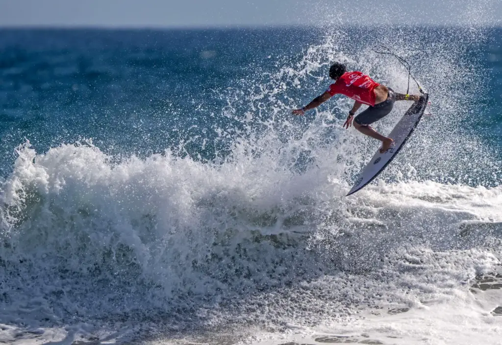 Josh Moniz of Hawaii launches into a 360 as he...
