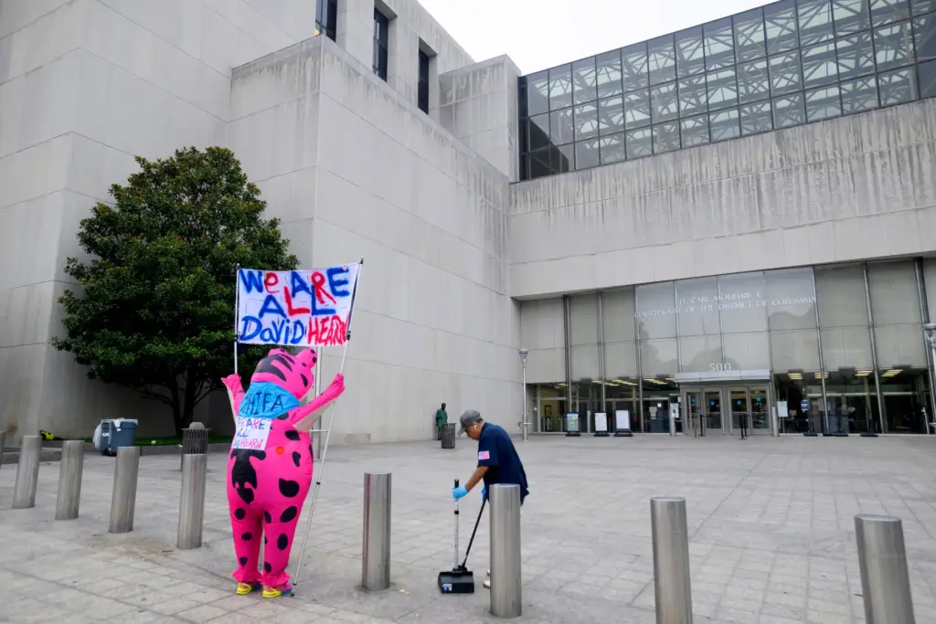 Nadine Seiler arrives in an inflatable frog costume, to support...