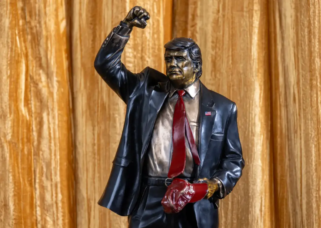 A miniature replica of a bronze statue of President Trump...