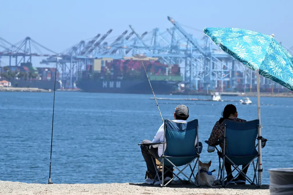 Anglers keep it cool at the Cabrillo Beach breakwater in...