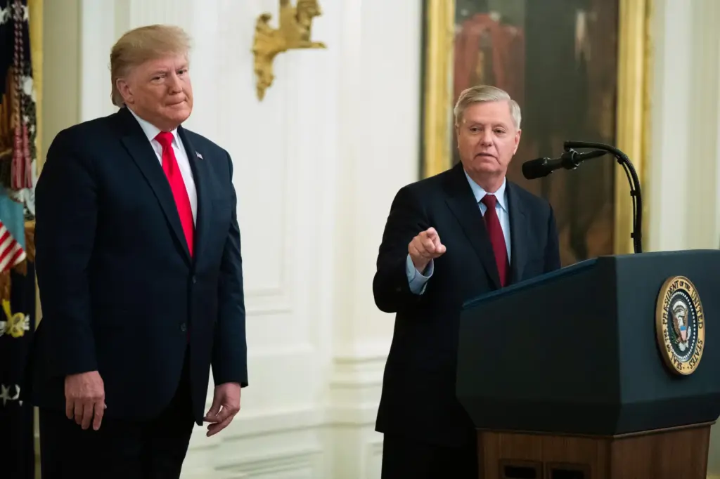 FILE – President Donald Trump listens to Sen. Lindsey Graham,...