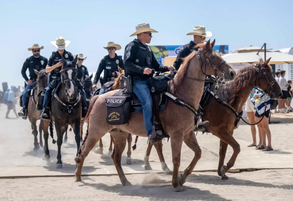 Huntington Beach mounted police officers patrol the US Open of...