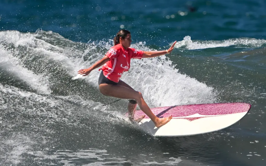 Avalon Gall competes in the U.S. Open of Surfing Longboard...