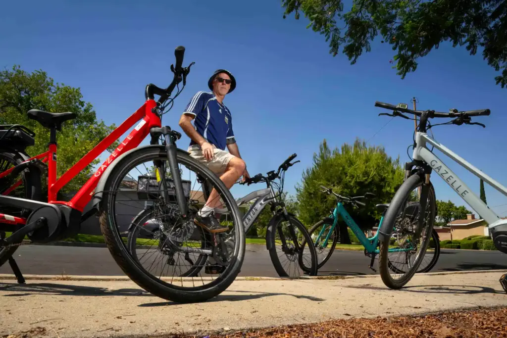Tim Tipping, who now has four e-bikes he uses for...