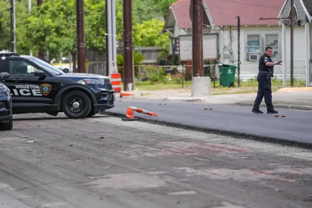 Police work on Canal Street in Houston, Tuesday, July 7,...
