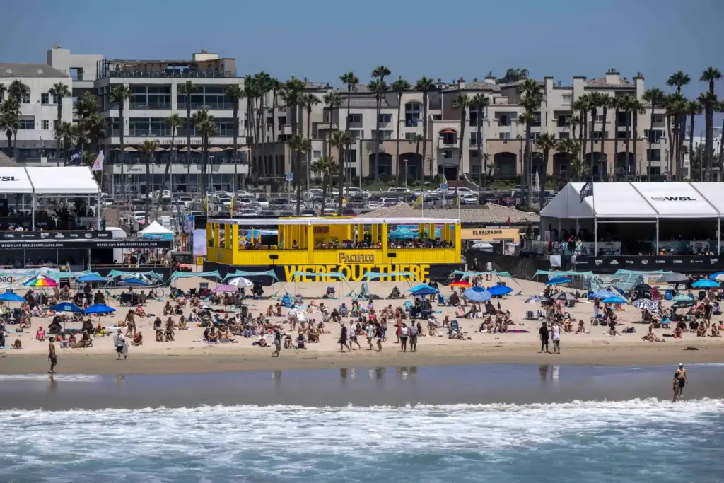 Hundreds of surf fans hang out in the temporary village,...