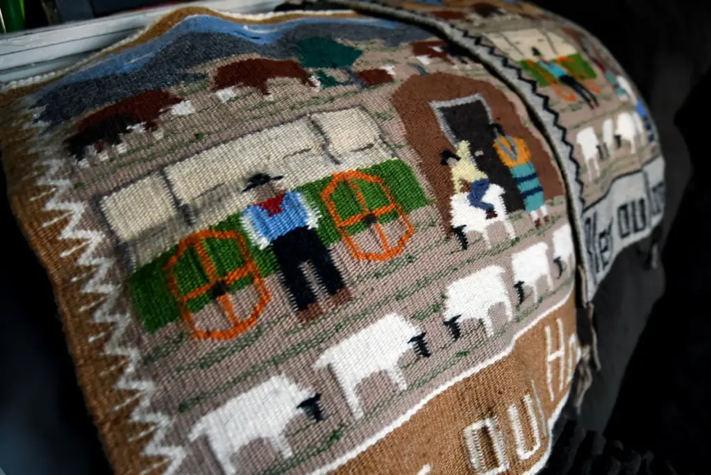 Weavings created by Ella Mae Begay are displayed in her son's home.