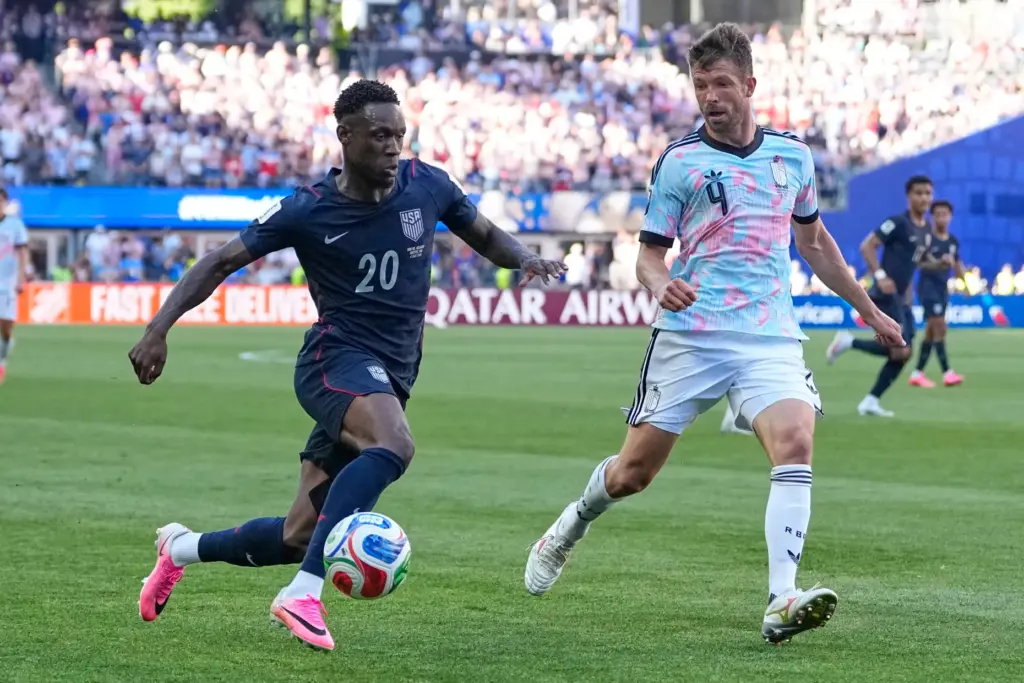 United States’ Folarin Balogun (20) and Belgium’s Brandon Mechele (4)...