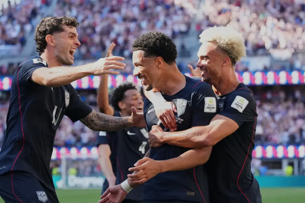 United States’ Malik Tillman, center, celebrates after scoring his side’s...