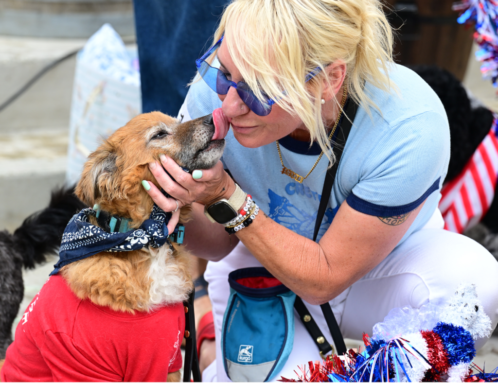 Hailey Villa gets a kiss from her dog Modelo, as...