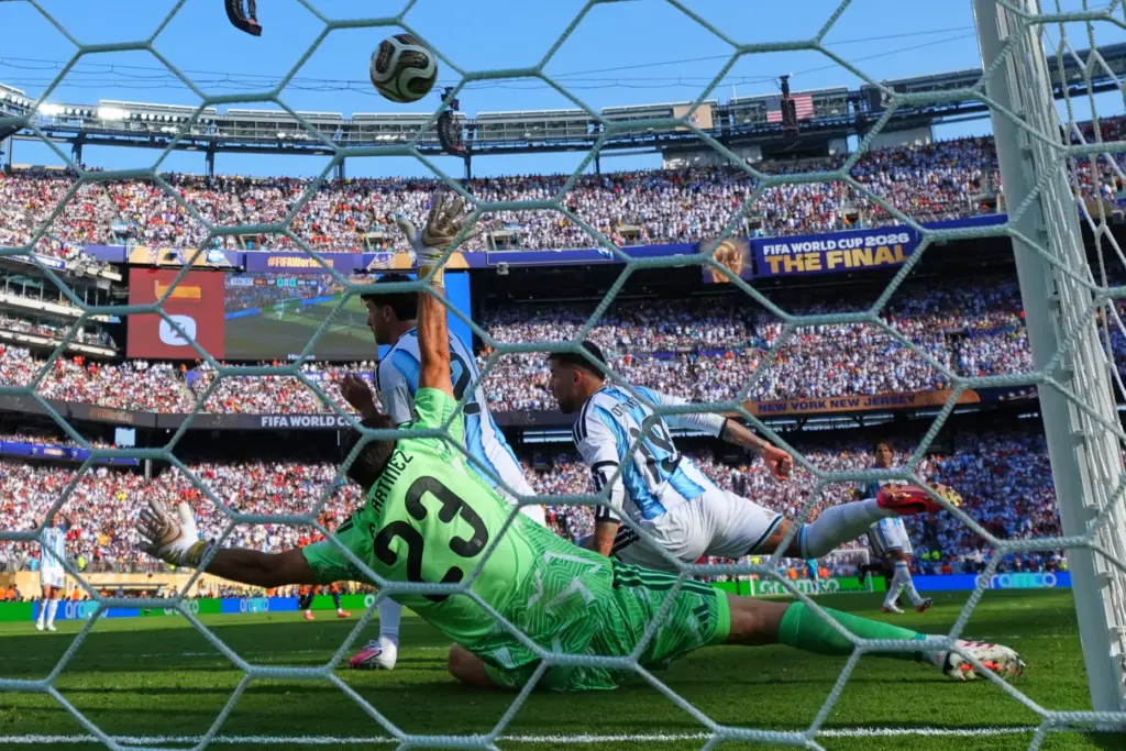 Spain’s Ferran Torres (7) scores their first goal past Argentina...