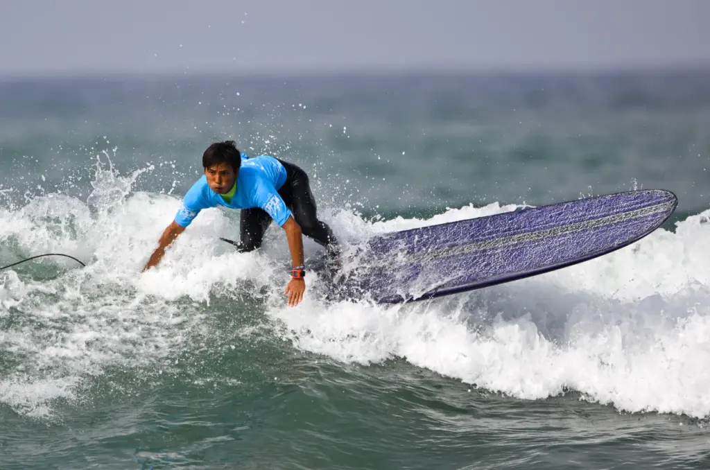 Taka Inoue competes during the elimination round for the longboard...