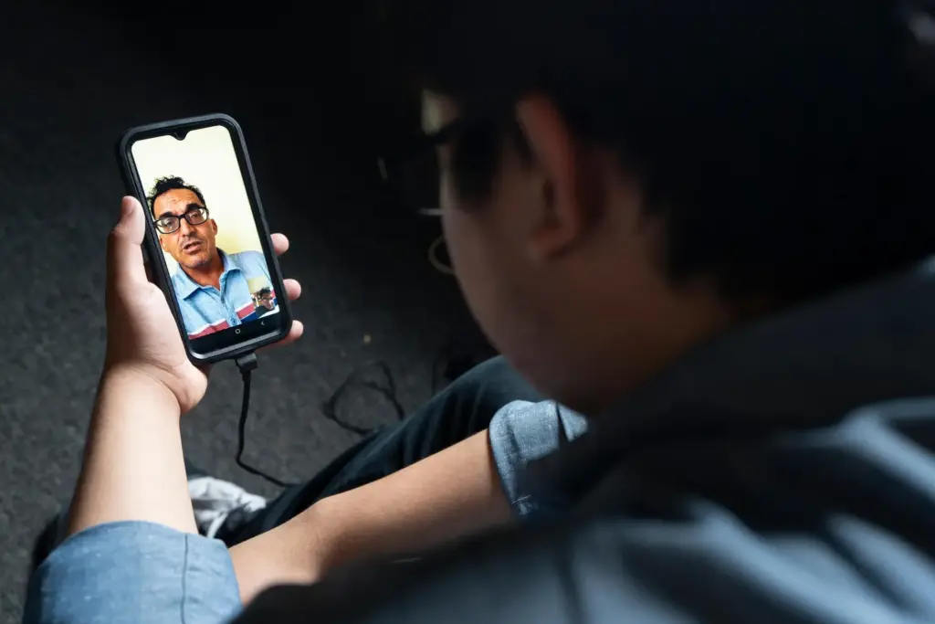 Damian ZermeÃ±o talks to his father over video chat.