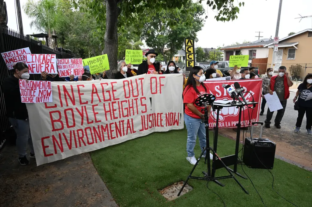 Alma Lagunas, a local resident speaks as community organizations held...