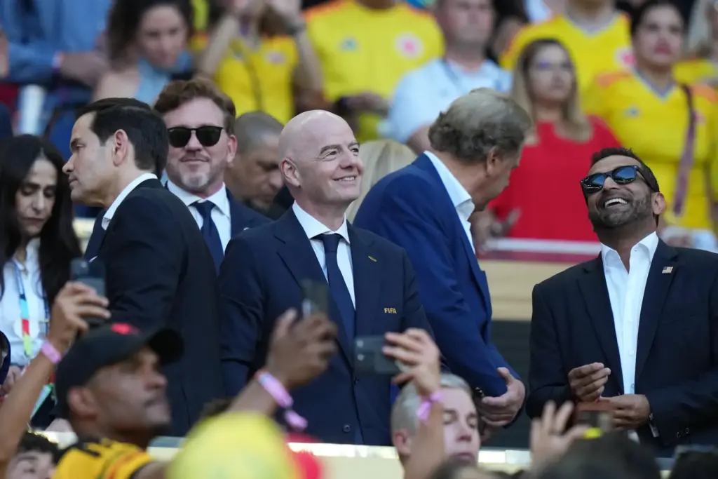 President Gianni Infantino stands with Secretary of State Marco Rubio and FBI Director Kash Patel.