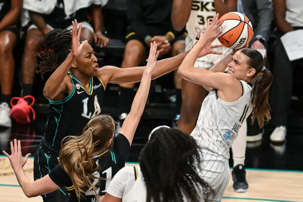 Chicago Sky rookie Gabriela Jaquez, right, is fouled by Sparks...