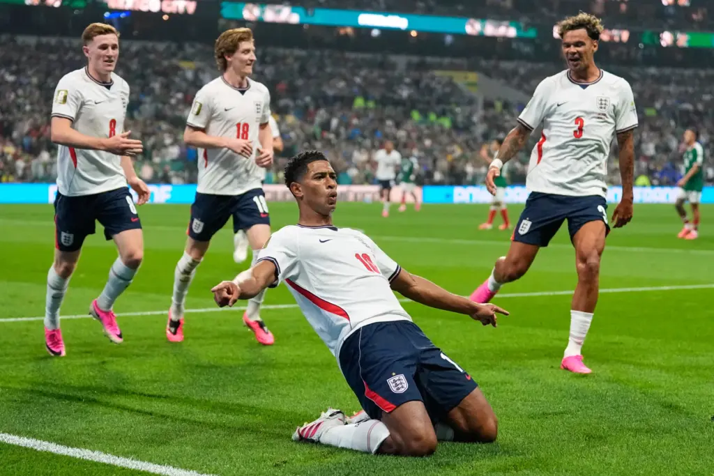 England’s Jude Bellingham (10) celebrates with teammates after scoring his...