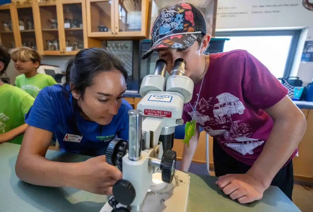 Riley Delgado, left, a camp counselor at the Ocean Institute,...