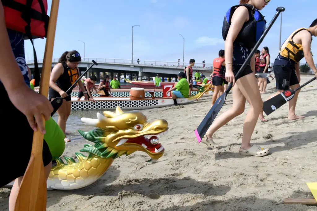 Teams exit their boats after a race in the Long...