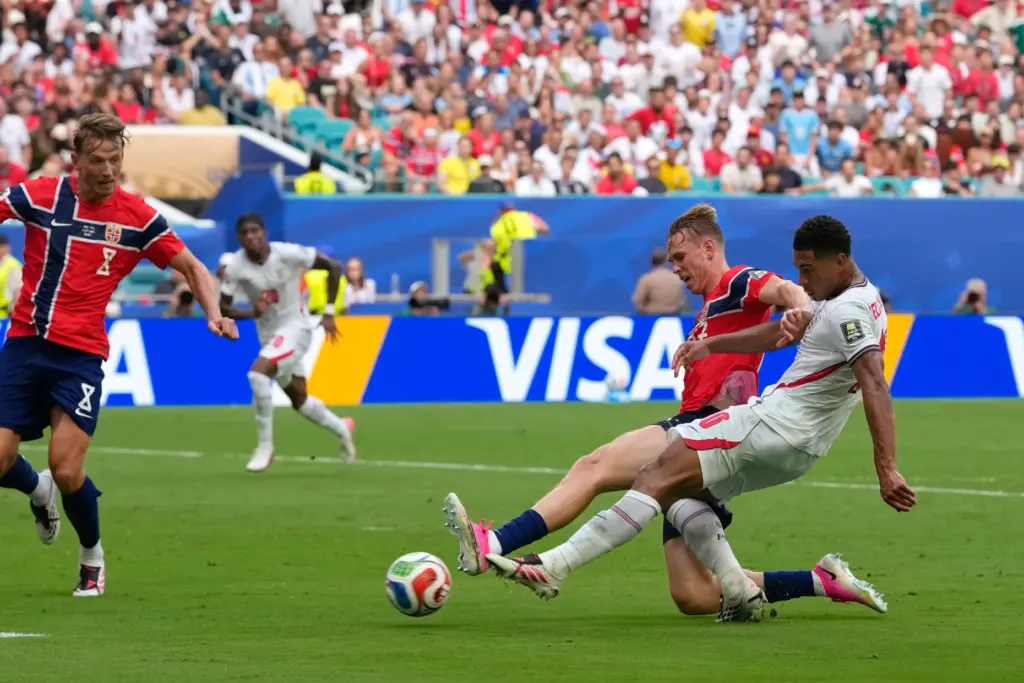 England’s Jude Bellingham, right, scores his side’s first goal during...