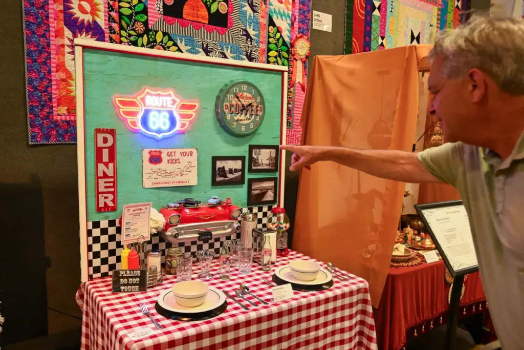 John Weiss, of Costa Mesa, points out a Route 66-themed...