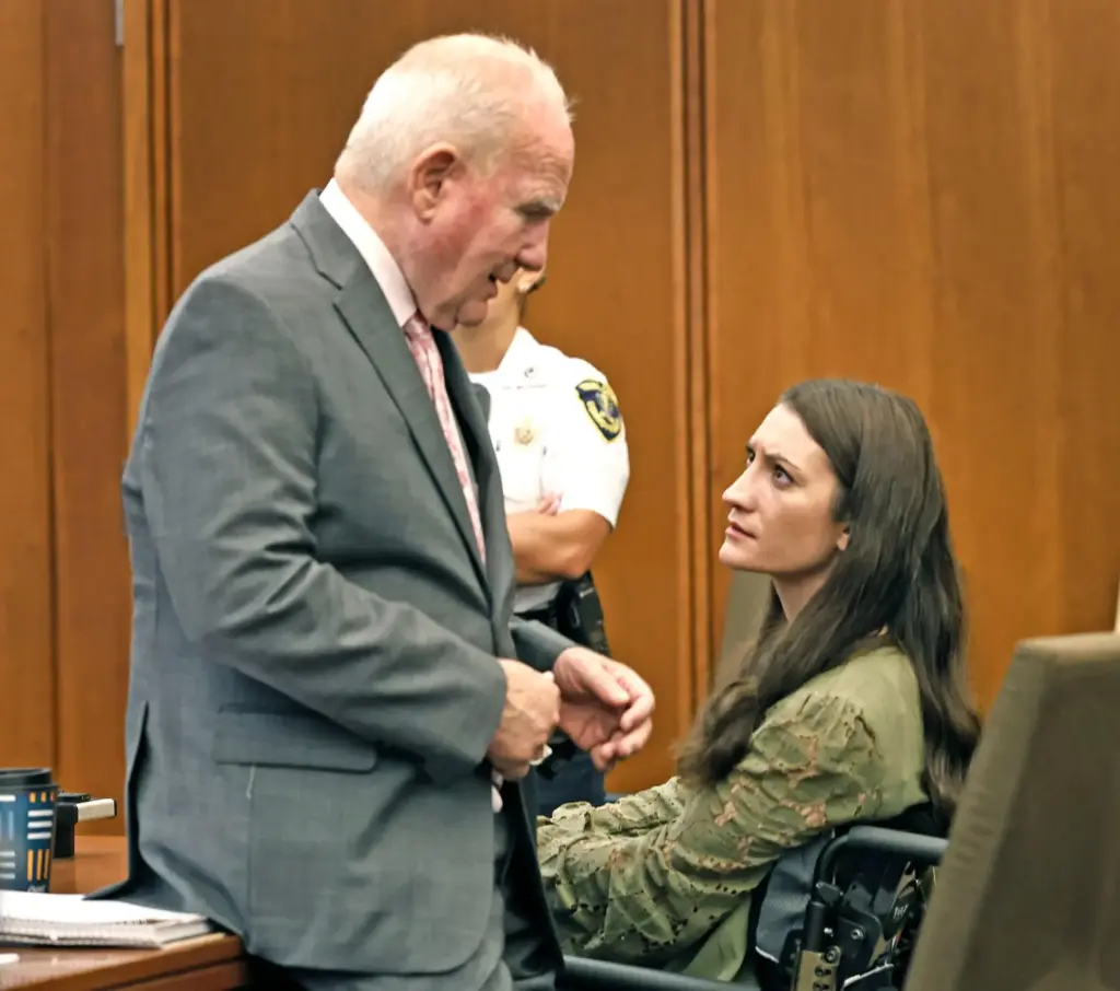 Defense attorney Kevin Reddington stays at the side of his...